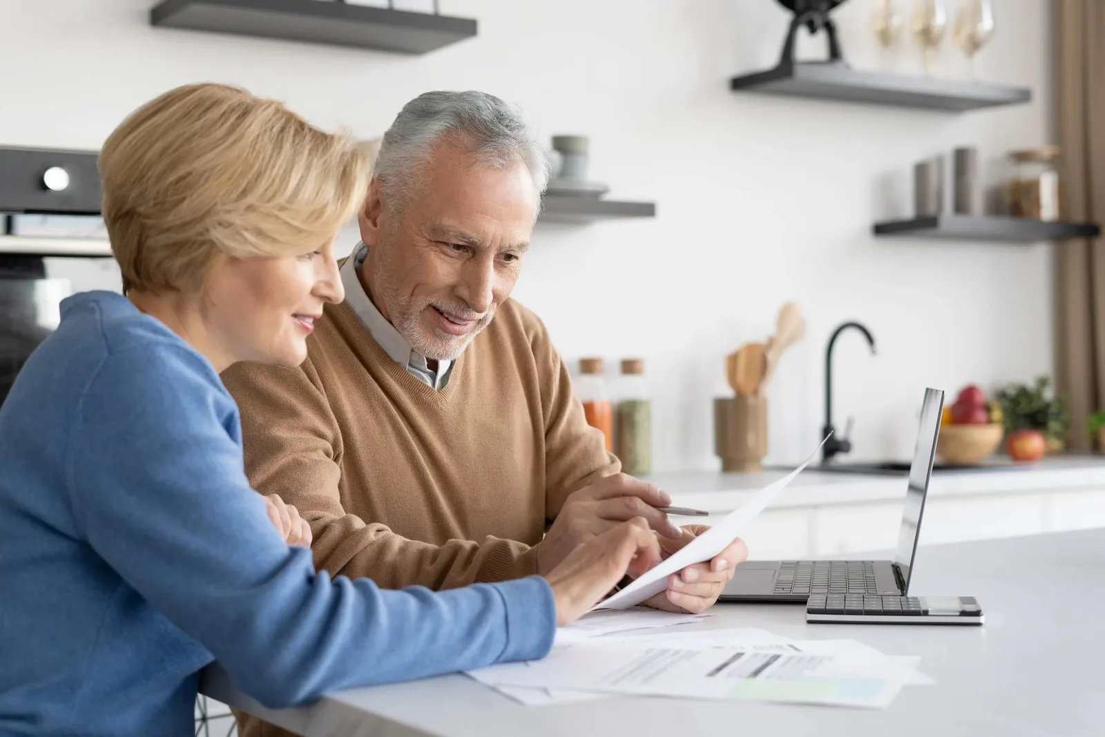 Couple reviewing retirement savings paperwork